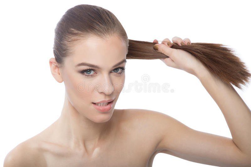 a woman yanking on her pantene pro-v ponytail